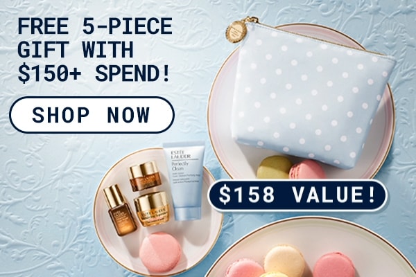 Photograph of the FREE 5 - Piece Gift with any purchase over $150. Product flatlay on plates with macarons.
