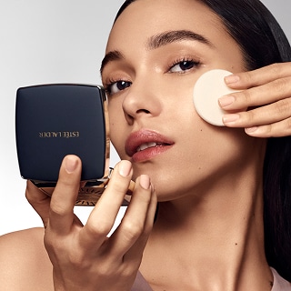 woman applying long lasting makeup from estee lauder